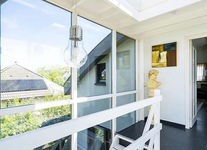 Gezellige zithoek in Westduin 19 vakantiehuis, Vlissingen, Walcheren, met moderne inrichting.