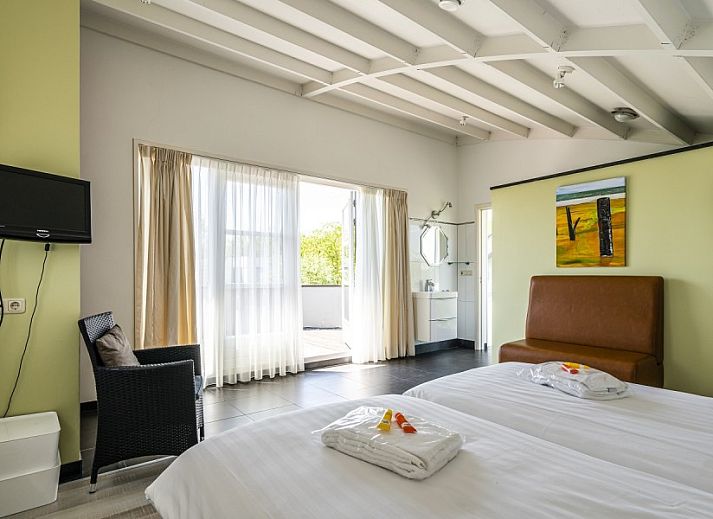 Gezellige zithoek in Westduin 19 vakantiehuis, Vlissingen, Walcheren, met moderne inrichting.