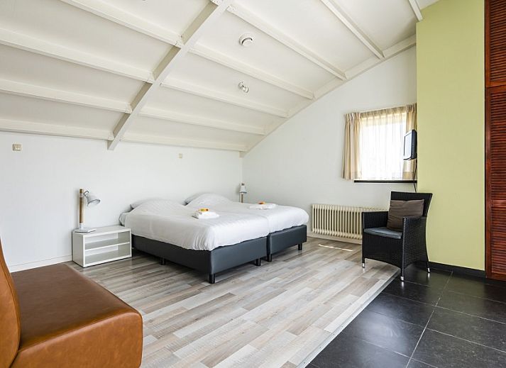 Gezellige zithoek in Westduin 19 vakantiehuis, Vlissingen, Walcheren, met moderne inrichting.