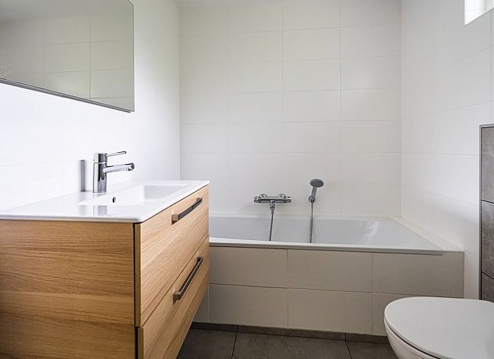 Gezellige woonkamer van Westduin 4 vakantiehuis in Vlissingen, met comfortabele zithoek, Walcheren, Zeeland.