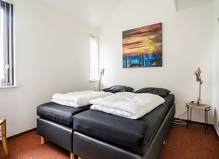 Gezellige woonkamer van Westduin 4 vakantiehuis in Vlissingen, met comfortabele zithoek, Walcheren, Zeeland.