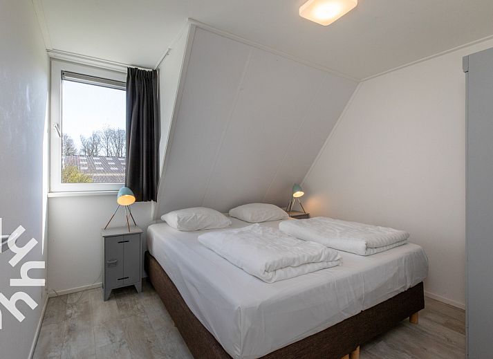 Ruime slaapkamer met meerdere bedden in vakantiehuis ZE1446, Aagtekerke, Walcheren.