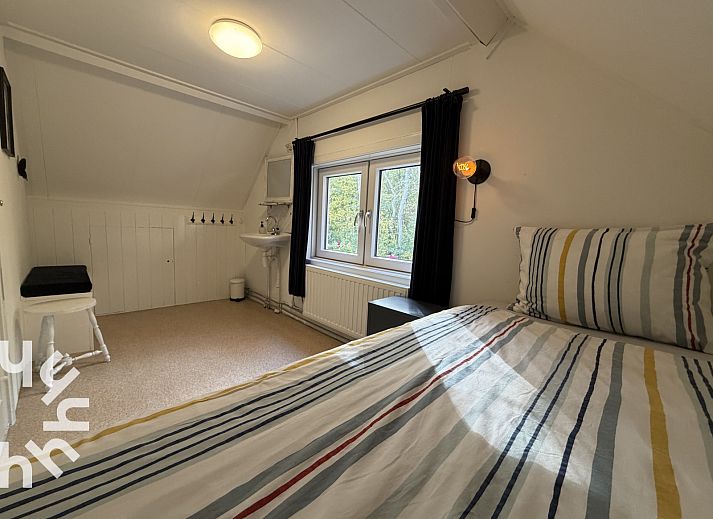 Cozy living room of vacation home ZE1541 in Zoutelande, Walcheren. Comfortable sitting area overlooking the nature of Zeeland.