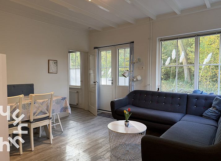 Cozy living room of vacation home ZE1541 in Zoutelande, Walcheren. Comfortable sitting area overlooking the nature of Zeeland.