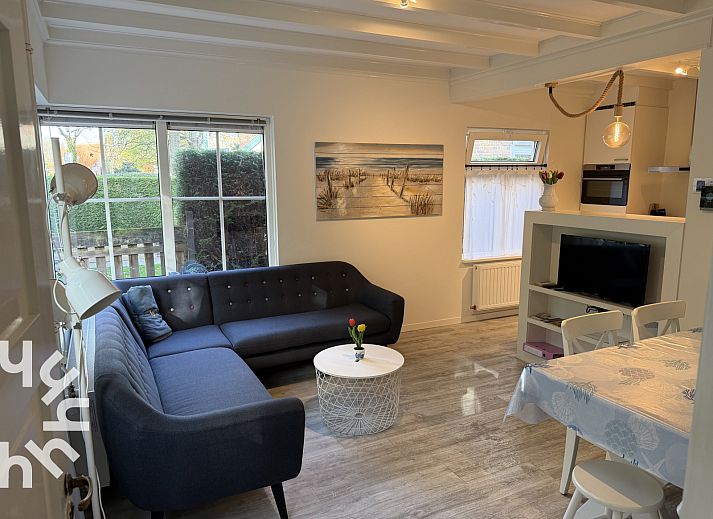 Cozy living room of vacation home ZE1541 in Zoutelande, Walcheren. Comfortable sitting area overlooking the nature of Zeeland.