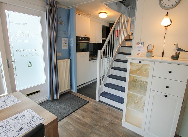 Cozy living room in Sealife - Zoutelande vacation home with dining area and lots of light.