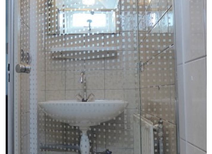 Cozy living room in Sealife - Zoutelande vacation home with dining area and lots of light.