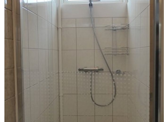 Cozy living room in Sealife - Zoutelande vacation home with dining area and lots of light.