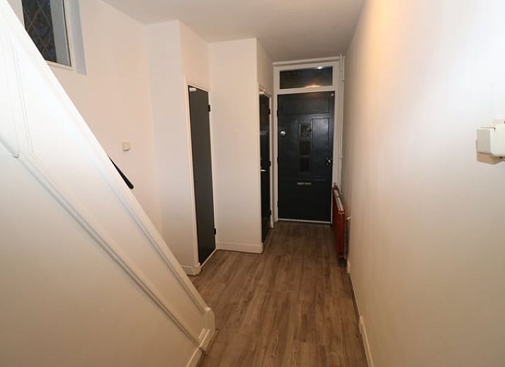 Buitenterras met barbecue bij Vakantiehuis in Arnemuiden, ideaal voor buitenleven in Walcheren, Zeeland.