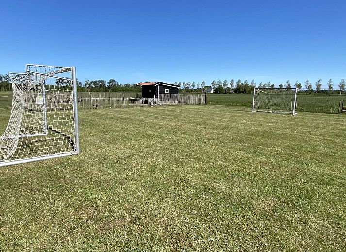 Moderne zithoek in VZ740 Vakantiewoning Vrouwenpolder, Walcheren, Zeeland.