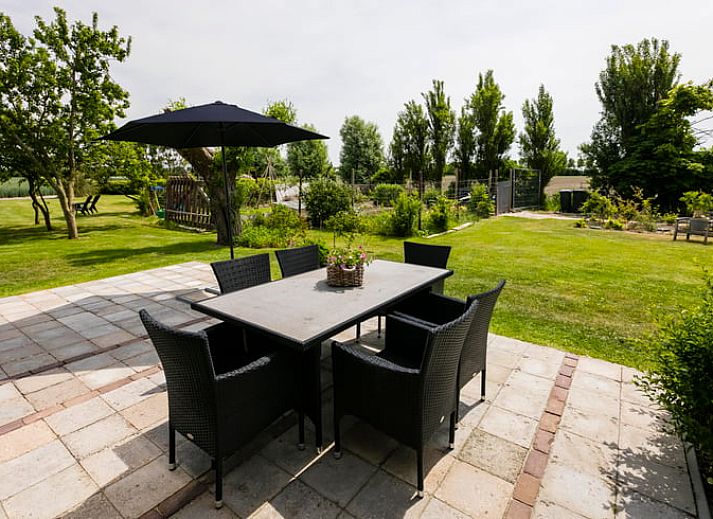 Gemuetliches Wohnzimmer des Ferienhauses in Vrouwenpolder, Walcheren, ideal fuer Familienurlaub in Zeeland.