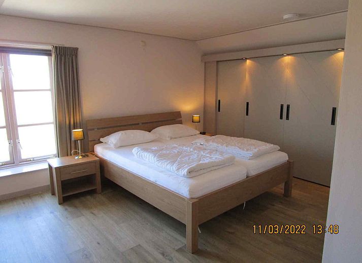 Aussenansicht des Ferienhauses ZE161 in Vrouwenpolder, Walcheren, umgeben von viel Gruen und Ruhe.