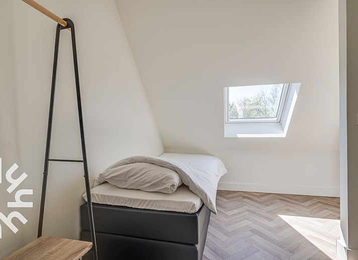 Sunny terrace at vacation home ZE1151 in Veere, Walcheren, Zeeland, ideal for outdoor meals.