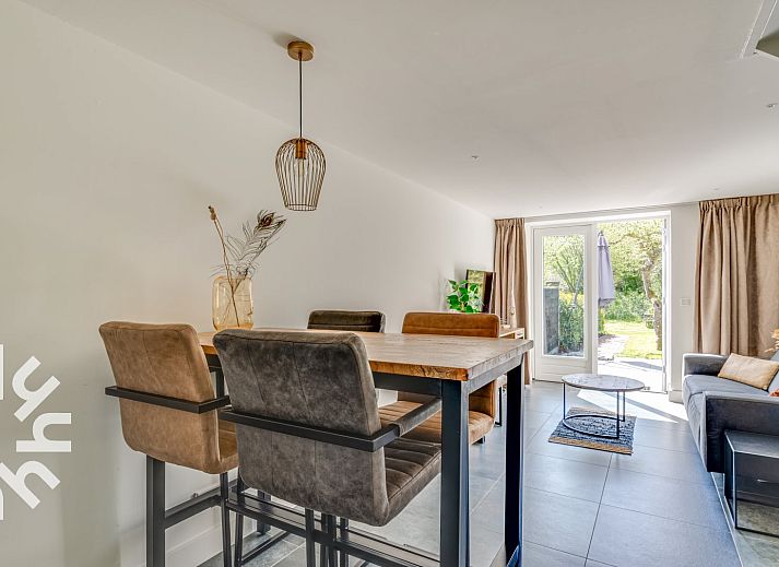 Sunny terrace at vacation home ZE1151 in Veere, Walcheren, Zeeland, ideal for outdoor meals.