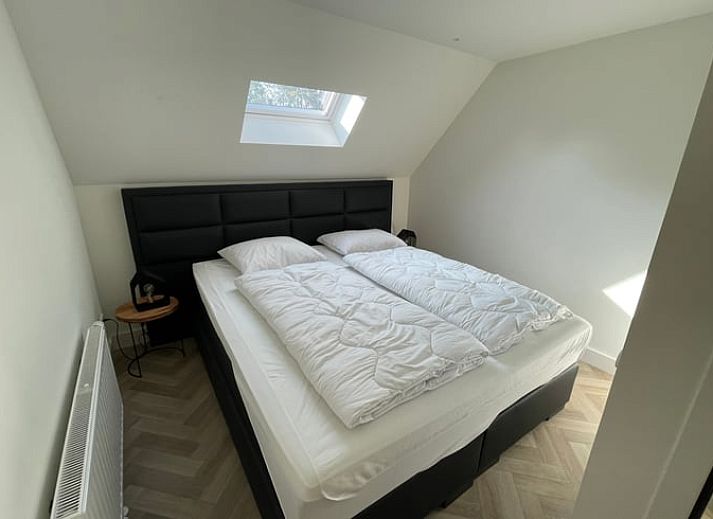 Gezellige woonkamer van Huisje in Veere, vakantiehuis in Walcheren, Zeeland met stijlvolle inrichting.