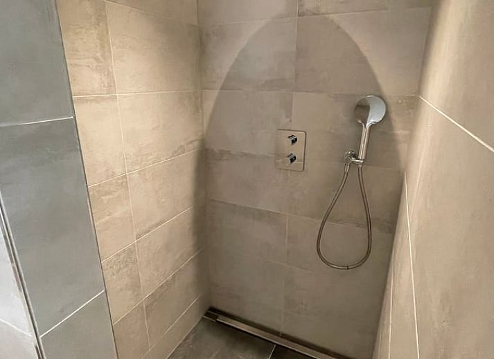 Gezellige woonkamer van Huisje in Veere, vakantiehuis in Walcheren, Zeeland met stijlvolle inrichting.