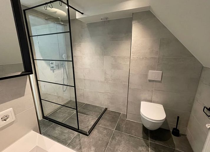 Gezellige woonkamer van Huisje in Veere, vakantiehuis in Walcheren, Zeeland met stijlvolle inrichting.