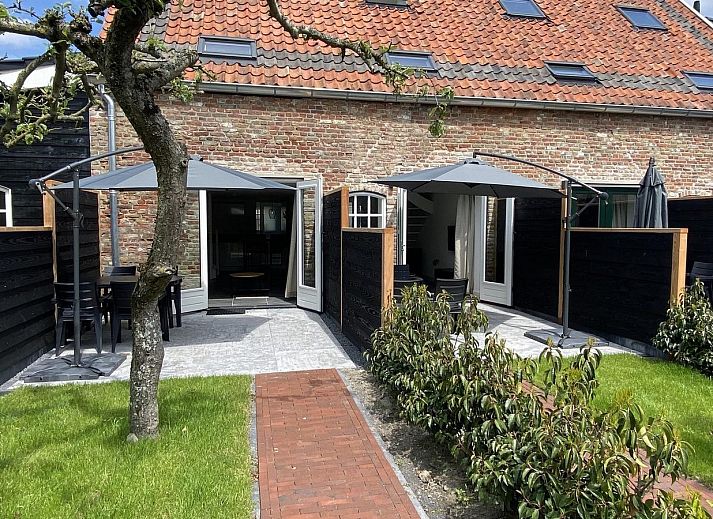 Exterior of VZ1022 Holiday apartment in Veere, Walcheren, Zeeland with an inviting terrace.