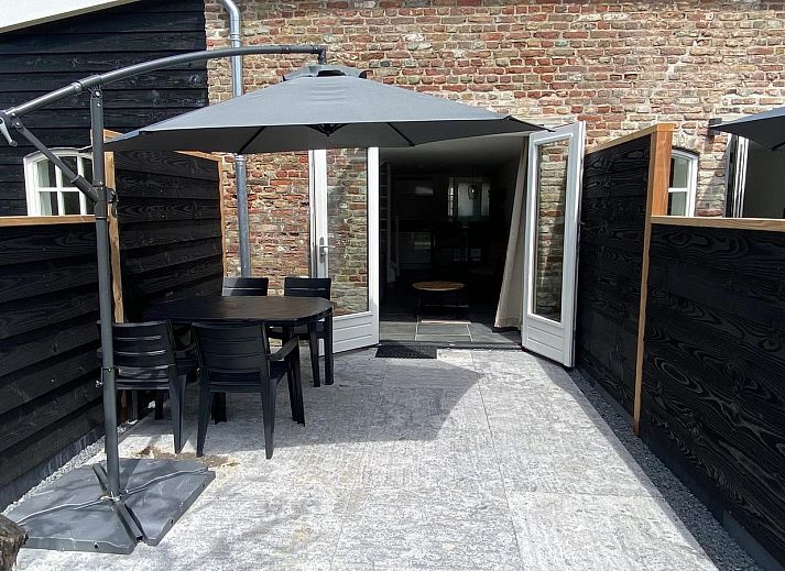 Exterior of VZ1022 Holiday apartment in Veere, Walcheren, Zeeland with an inviting terrace.