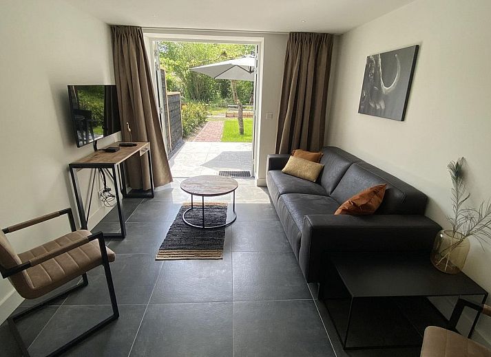 Cozy terrace of VZ1022 Holiday apartment in Veere, Walcheren, Zeeland overlooking the garden.