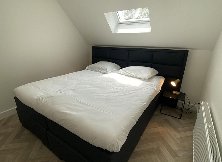 Rustic exterior of VZ1022 Holiday apartment in Veere, Walcheren, Zeeland with sunny terrace.