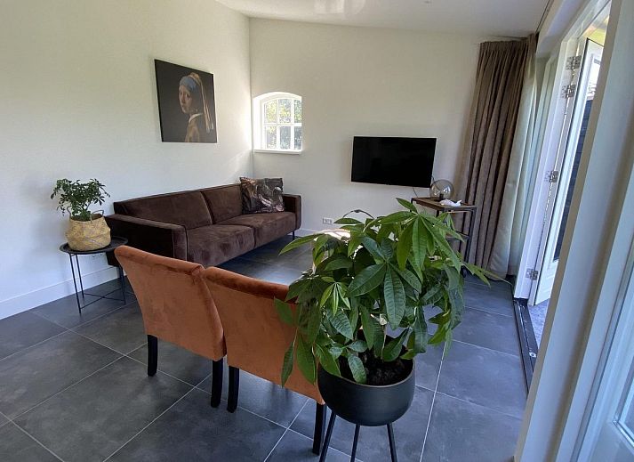 Relax on the sun loungers in the garden of VZ1064 Luxury vacation apartment in Veere, Walcheren, Zeeland.