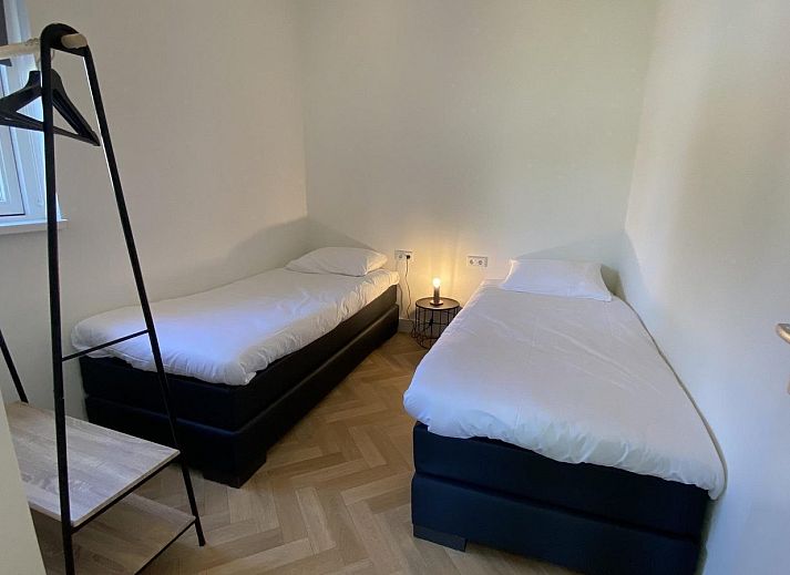 Spacious garden with shaded areas at VZ1064 Luxury vacation apartment in Veere, Walcheren, Zeeland.