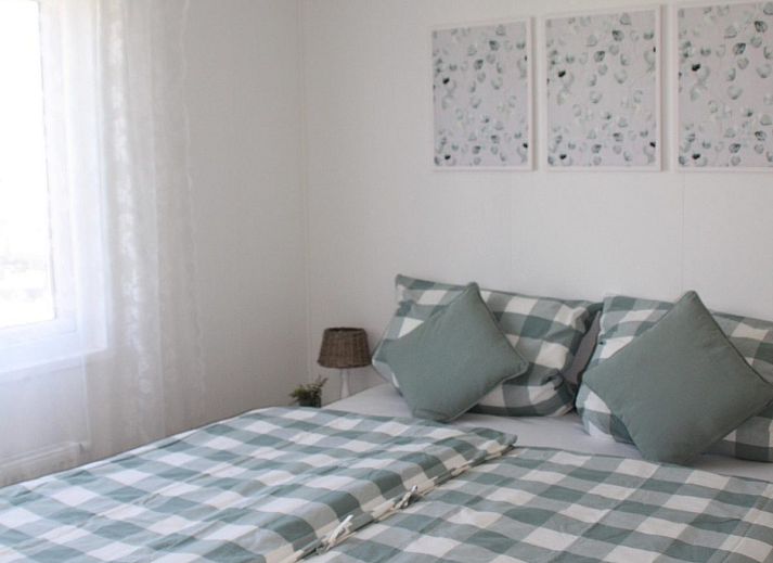 Lounge area on the veranda of VZ824 Chalet in Veere, Serooskerke, Walcheren, ideal for relaxation.