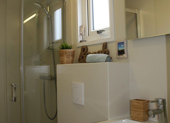 Lounge area on the veranda of VZ824 Chalet in Veere, Serooskerke, Walcheren, ideal for relaxation.