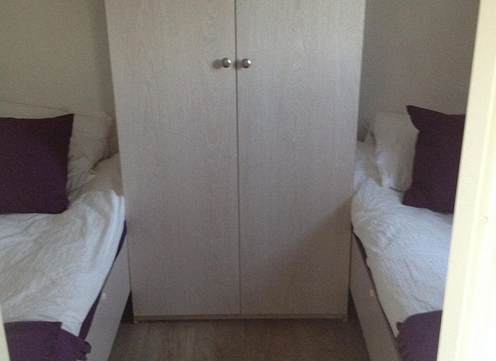 Cozy terrace at VZ814 Chalet in Veere, Serooskerke, Walcheren, with comfortable seating and floral displays.