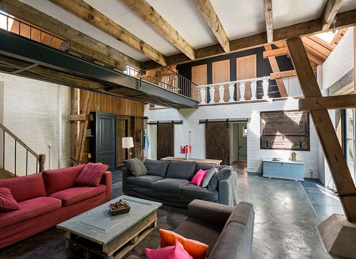 Cozy terrace at Mariekerke vacation home in Meliskerke, Walcheren, with ample seating and green surroundings.