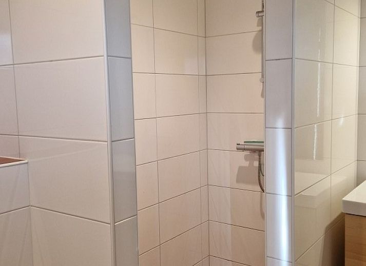 Modern sitting area in Holiday home Meidoorn, Meliskerke, Walcheren. Stylish decor for a relaxing stay.