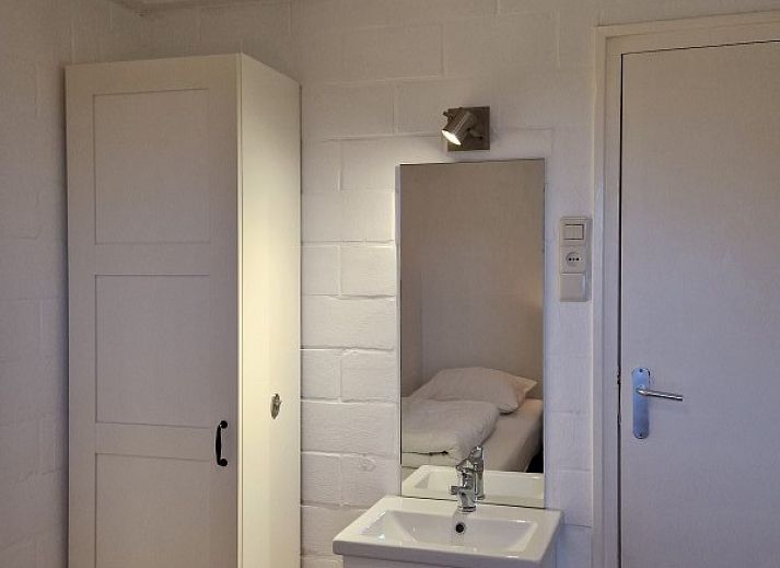 Dining and sitting area in Holiday home Meidoorn, Meliskerke, Walcheren. Spacious interior space with lots of natural light.