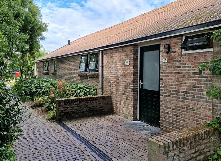 Dining and sitting area in Holiday home Meidoorn, Meliskerke, Walcheren. Spacious interior space with lots of natural light.
