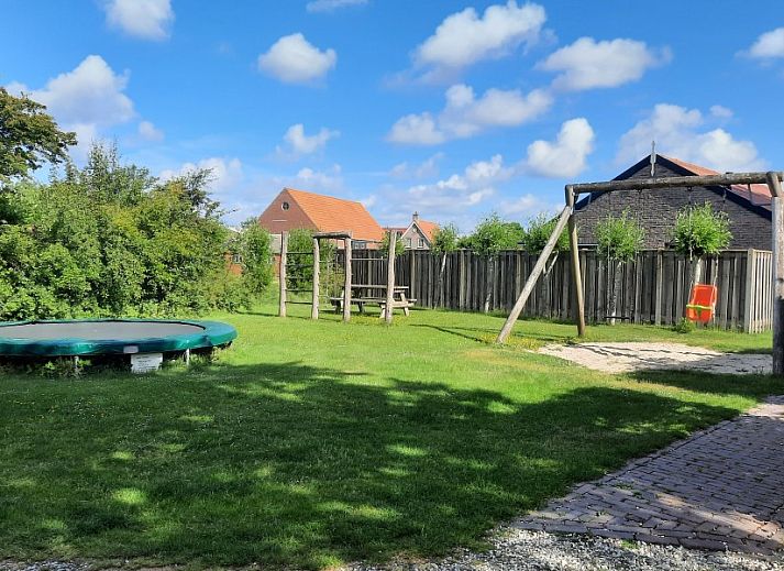 Dining and sitting area in Holiday home Meidoorn, Meliskerke, Walcheren. Spacious interior space with lots of natural light.