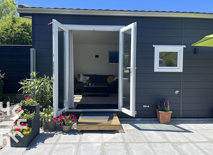 Relax on the comfortable lounge set at ZE1415 in Gapinge, Walcheren, Zeeland.