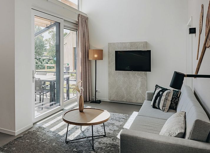 Zeeaster 4 vakantiehuis in Breskens, Zeeuws-Vlaanderen met moderne veranda en groene tuin in het rustige Zeeland.