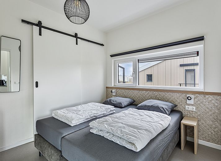 Vrijstaande woning in Breskens, Zeeuws-Vlaanderen, met groene omgeving en moderne architectuur, ideaal voor een ontspannen vakantie in Zeeland.