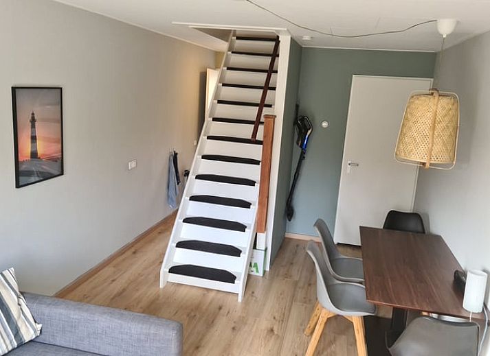 Front view of Holiday home in Breskens, Zeeuws-Vlaanderen. Charming vacation home in Zeeland with wooden facade.