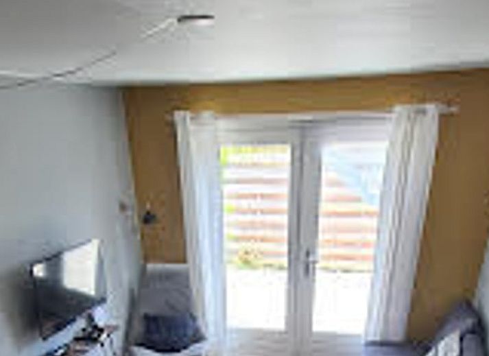 Front view of Holiday home in Breskens, Zeeuws-Vlaanderen. Charming vacation home in Zeeland with wooden facade.