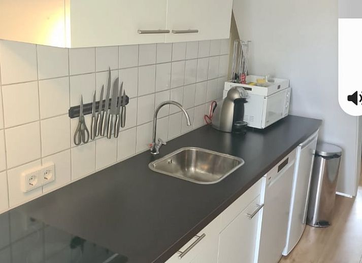 Front view of Holiday home in Breskens, Zeeuws-Vlaanderen. Charming vacation home in Zeeland with wooden facade.