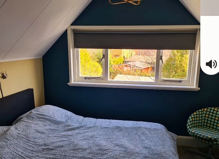 Front view of Holiday home in Breskens, Zeeuws-Vlaanderen. Charming vacation home in Zeeland with wooden facade.