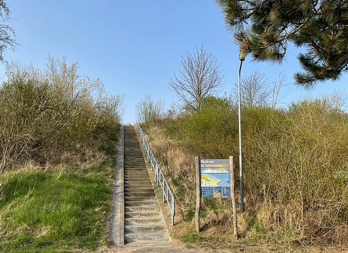 Modern interior of Holiday home in Breskens, Zeeuws-Vlaanderen. Comfortable sitting area and dining area in this vacation home.