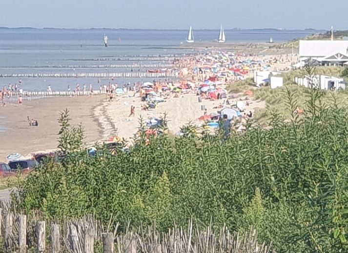 Modern interior of Holiday home in Breskens, Zeeuws-Vlaanderen. Comfortable sitting area and dining area in this vacation home.