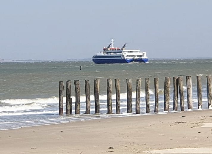 Modern interior of Holiday home in Breskens, Zeeuws-Vlaanderen. Comfortable sitting area and dining area in this vacation home.