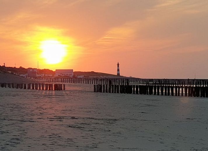 Modern interior of Holiday home in Breskens, Zeeuws-Vlaanderen. Comfortable sitting area and dining area in this vacation home.