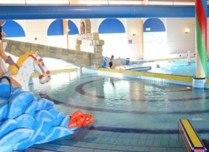 Cozy living room in Holiday home in Breskens, Zeeuws-Vlaanderen, Zeeland. Relaxed atmosphere with comfortable sofa.