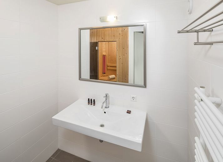 Gezellige woonkamer van Villa 8G Luxe in Cadzand-bad, Zeeuws-Vlaanderen. Comfortabel vakantiehuis met moderne inrichting in Zeeland.