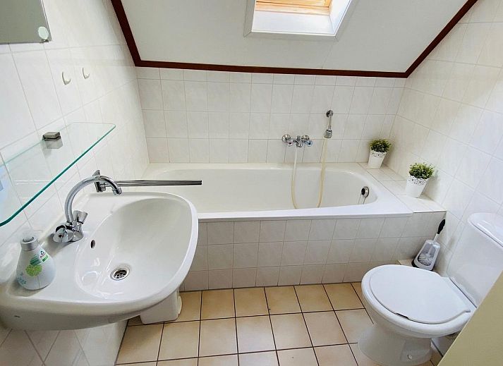 Cozy living room of VZ921 Holiday home in Cadzand-Bad overlooking the garden, Zeeland.