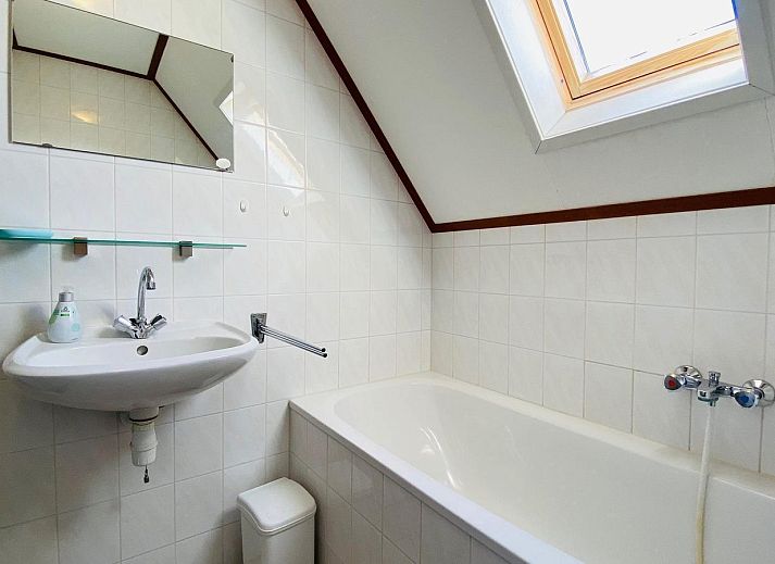 Cozy living room of VZ921 Holiday home in Cadzand-Bad overlooking the garden, Zeeland.